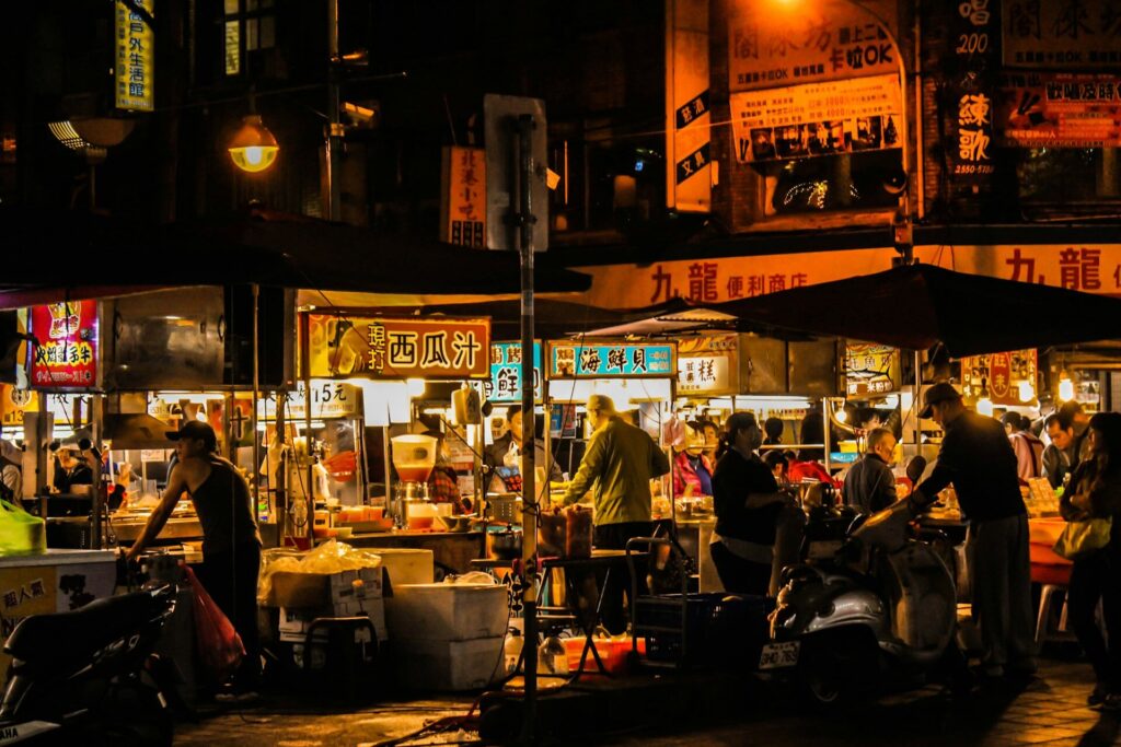 Surfing in Taiwan: Lights illuminate a busy night market