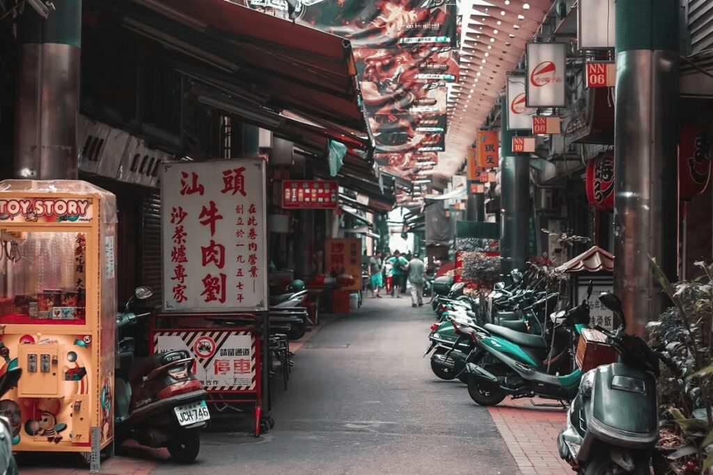 Surfing in Taiwan: Motorbikes parked along a narrow laneway
