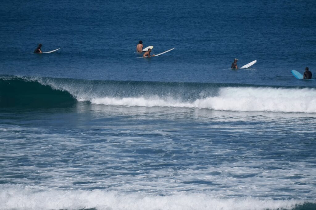 Longboarders waiting for waves while surfing in Taiwan