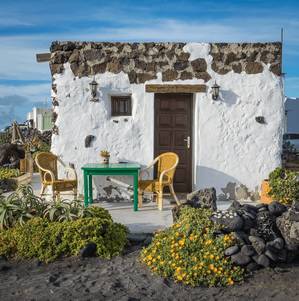 Surfing in the Canary Islands: A whitewashed stone building drenched in sunshine