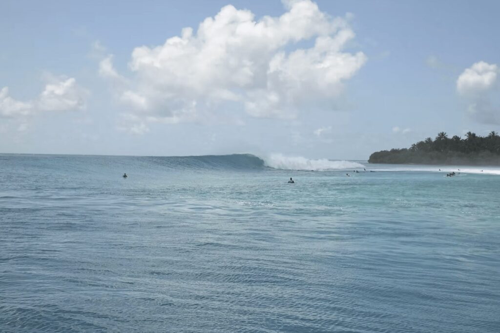 Waves break near the eco-friendly EQ Surf Retreat in the Maldives 
