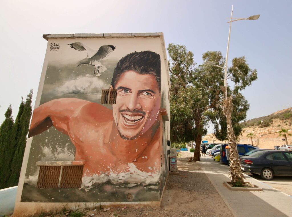 Best places to surf in Morocco: A mural of a surfer in Taghazout