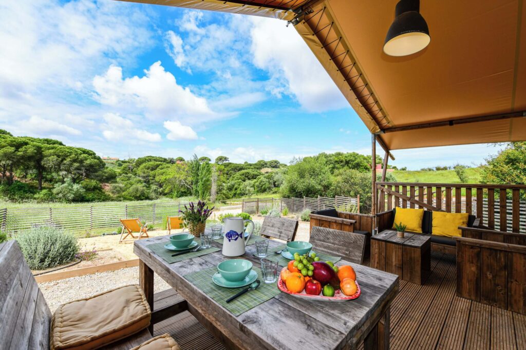 Views across the rolling countryside from a dining space at wecamp Reserva Alecrim